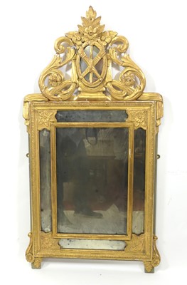 Lot 2311 - A giltwood and gesso wall mirror, in the 18th...