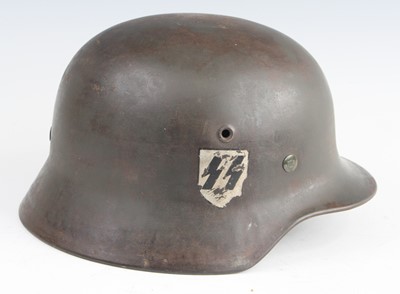 Lot 3424 - A German M42 steel helmet, having single SS...