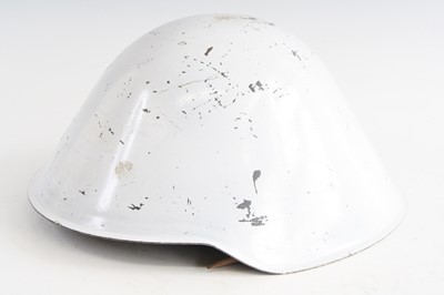 Lot 661 - An East German M56 / 76 steel combat helmet,...