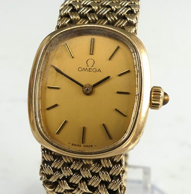 Lot 2142 - A lady's Omega 9ct gold cased bracelet watch,...