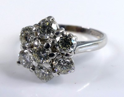 Lot 2098 - An 18ct white gold diamond flower head cluster...