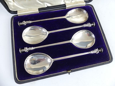 Lot 2062 - A cased set of four silver seal-top apostle...