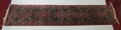 Lot 2337 - A Persian Ghom silkwork hall runner, decorated...