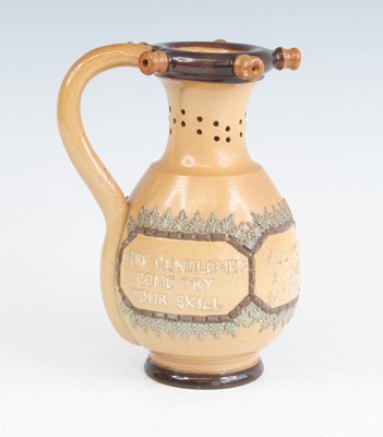 Lot 2065 - A Doulton Lambeth stoneware puzzle jug, the...