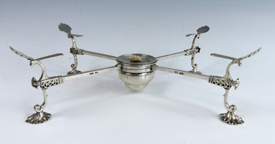 Lot 2209 - A George III silver cross plate-warmer, the...
