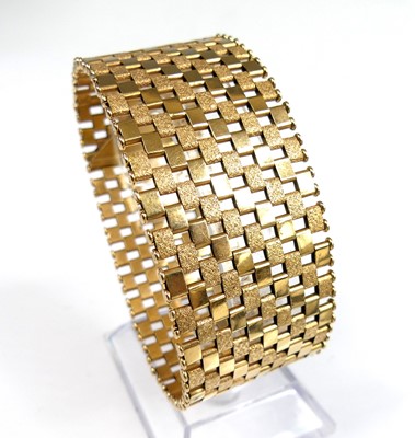 Lot 2338 - A yellow metal textured and polished bar link...