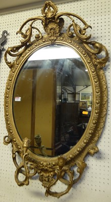 Lot 1106 - A 19th century and later gilded oval wall...