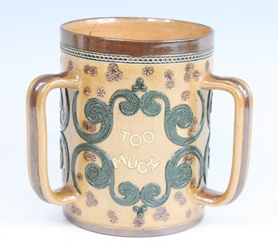 Lot 2056 - A Doulton Lambeth stoneware tyg, on a buff...