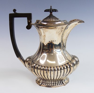 Lot 2178 - An Edwardian silver coffee pot, of half reeded...