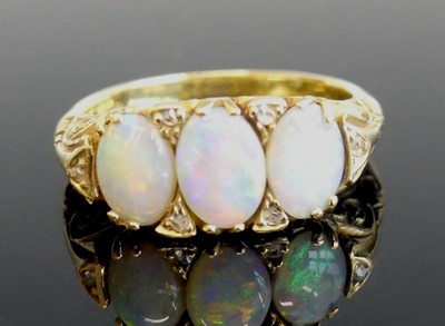 Lot 2312 - A yellow metal, opal and diamond dress ring,...