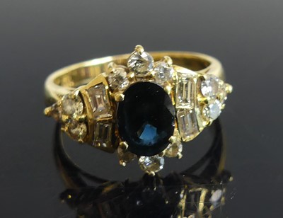 Lot 2253 - A yellow metal, sapphire and diamond fancy...