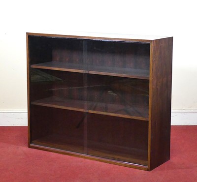 Lot 451 - A 1970s hardwood low bookcase, the twin glazed...