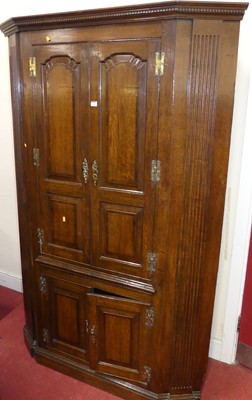 Lot 1142 - A George III provincial oak and mahogany...