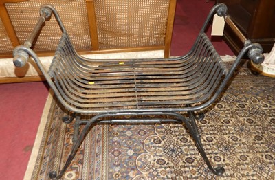 Lot 1255 - A black painted wrought iron X-frame garden...