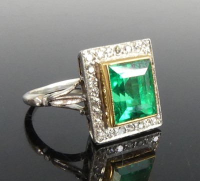 Lot 2331 - A white and yellow metal, emerald and diamond...