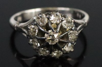 Lot 267 - A white metal diamond circular cluster ring,...