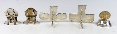 Lot 2104 - A collection of silver and white metal novelty...