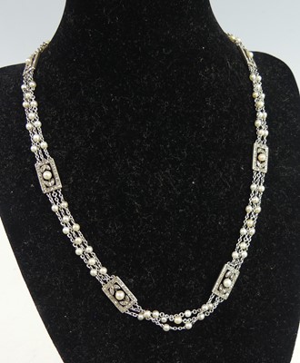 Lot 2313 - A white and yellow metal, pearl and diamond...