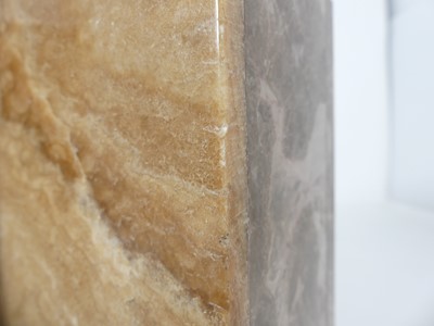 Lot 9 - A French Art Deco variegated marble clock...