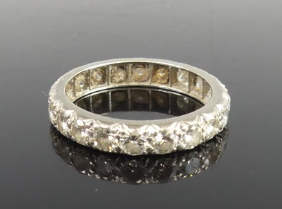 Lot 2310 - A white metal eternity ring featuring 20 round...