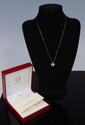 Lot 300 - A white metal aquamarine and diamond pendant,...