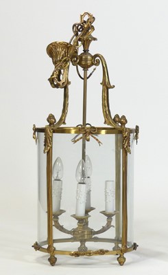 Lot 2515 - A gilt brass four-light ceiling pendant, of...