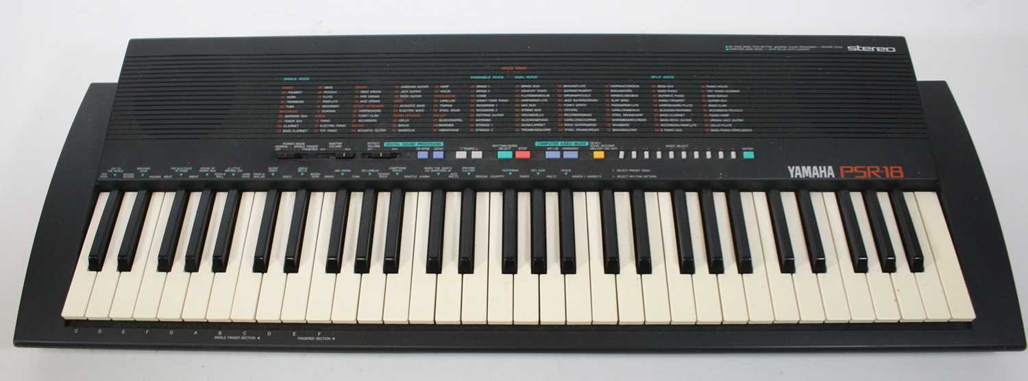 Lot 129 - A Yamaha PSR-18 keyboard, with power lead and...