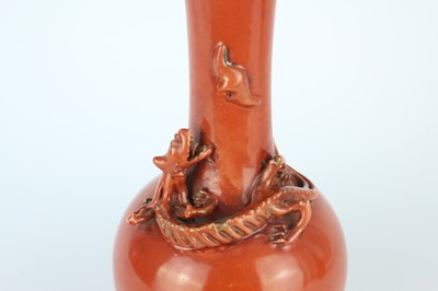 Lot 84 - A pair of Chinese coral-red bottle vases with...