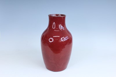 Lot 10 - A Chinese copper-red glazed baluster vase,...