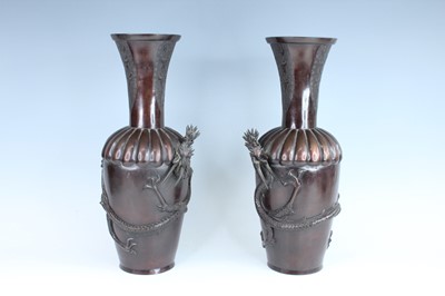 Lot 257 - A pair of Japanese bronze dragon vases, Meiji...