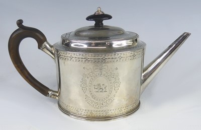 Lot 2245 - A George III silver teapot, of oval form with...