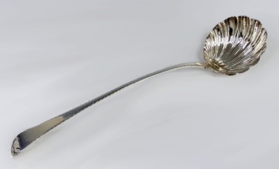 Lot 2099 - A George III silver soup ladle, in the Feather-...