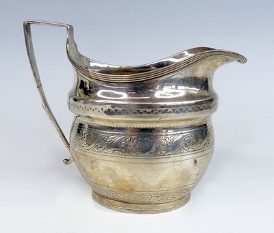 Lot 2119 - A George III silver cream jug, having banded...