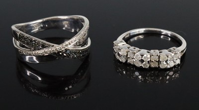 Lot 277 - Two diamond rings, to include a black and...