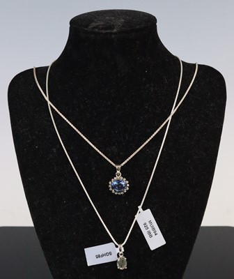 Lot 296 - Two gemset pendants: to include an oval...