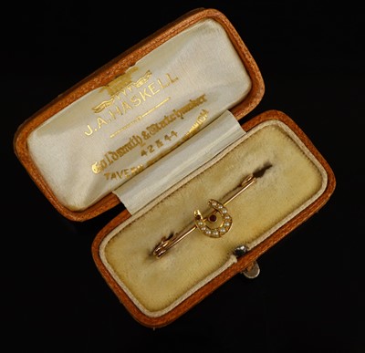 Lot 281 - A seed pearl horseshoe brooch, set in unmarked...