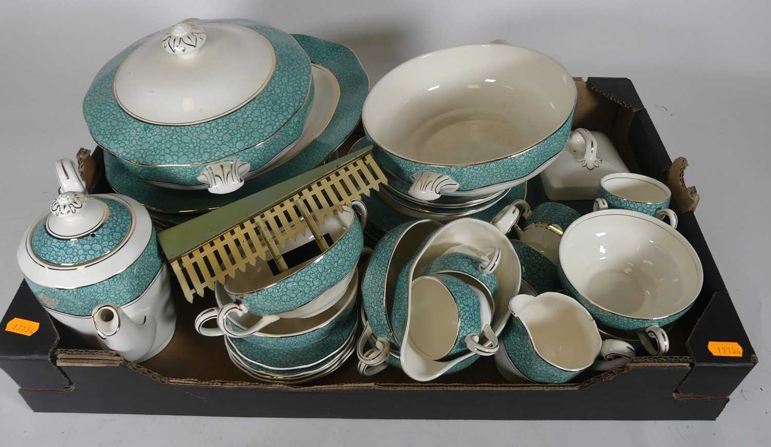 Lot 54 - A tray containing a part tea service and...