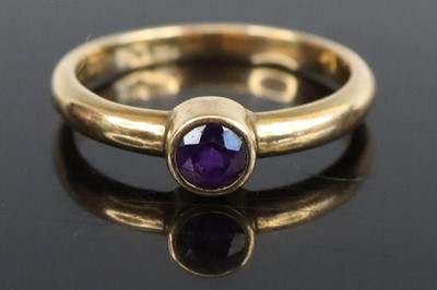 Lot 265 - A 9ct gold amethyst set band ring, size R, 3.2g