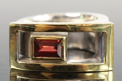 Lot 266 - A contemporary silver, gold-topped and garnet...