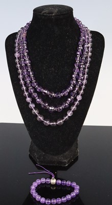 Lot 297 - A beaded and faceted amethyst glass double...