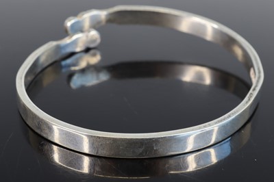 Lot 301 - A modern silver cuff bangle, sponsor JHR, dia....