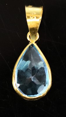 Lot 310 - A contemporary 14ct gold pear-cut blue topaz...
