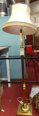 Lot 1173 - A turned and reeded brass standard lamp with...