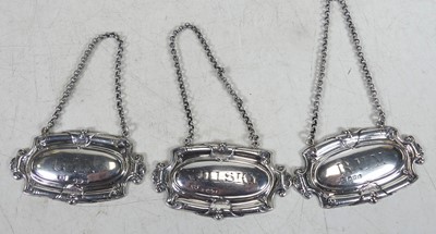 Lot 235 - A set of three late Victorian silver decanter...