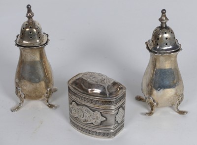 Lot 242 - A pair of silver pepperettes, height 8cm,...