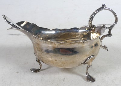 Lot 246 - A George V silver sifting spoon, 11cm,...