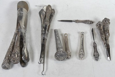 Lot 257 - A collection of silver handled implements and...