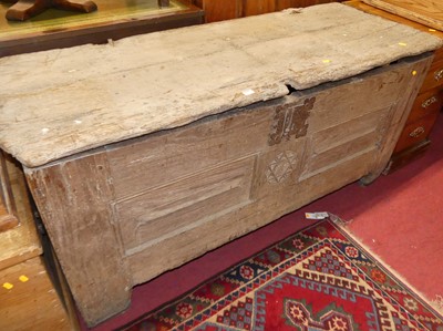Lot 1311 - An antique joined oak hinge topped twin...