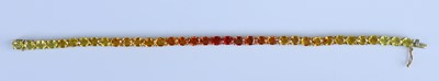 Lot 2654 - A 9ct yellow gold synthetic sapphire line...