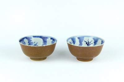 Lot 63 - A pair of Chinese iron-brown glazed and...